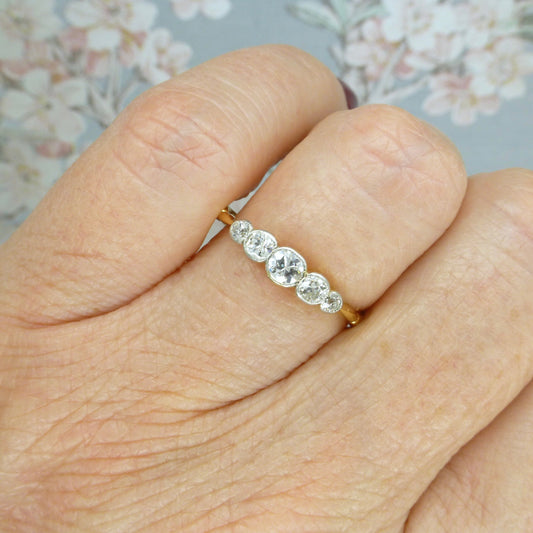 Antique Edwardian 18ct platinum bezel set old cut diamond five stone ring c1910s