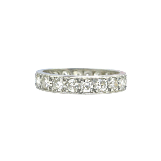 Art Deco Era platinum old cut diamond full eternity ring shown on a white background