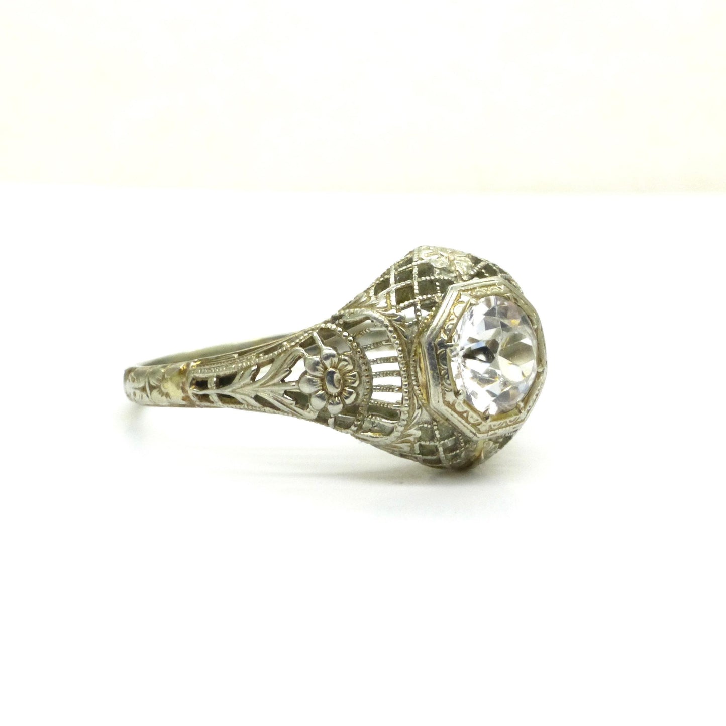 Antique white gold filigree and white sapphire solitaire ring c1900's