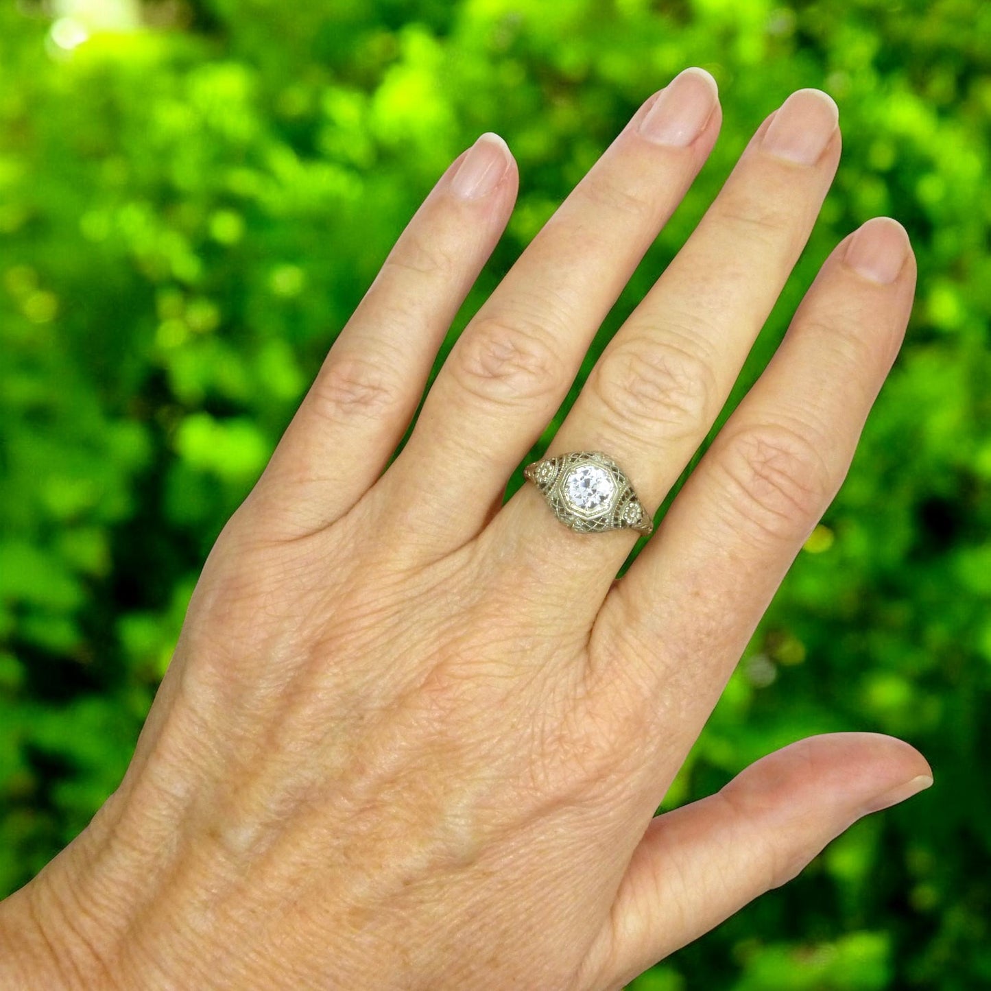 Antique white gold filigree and white sapphire solitaire ring c1900's