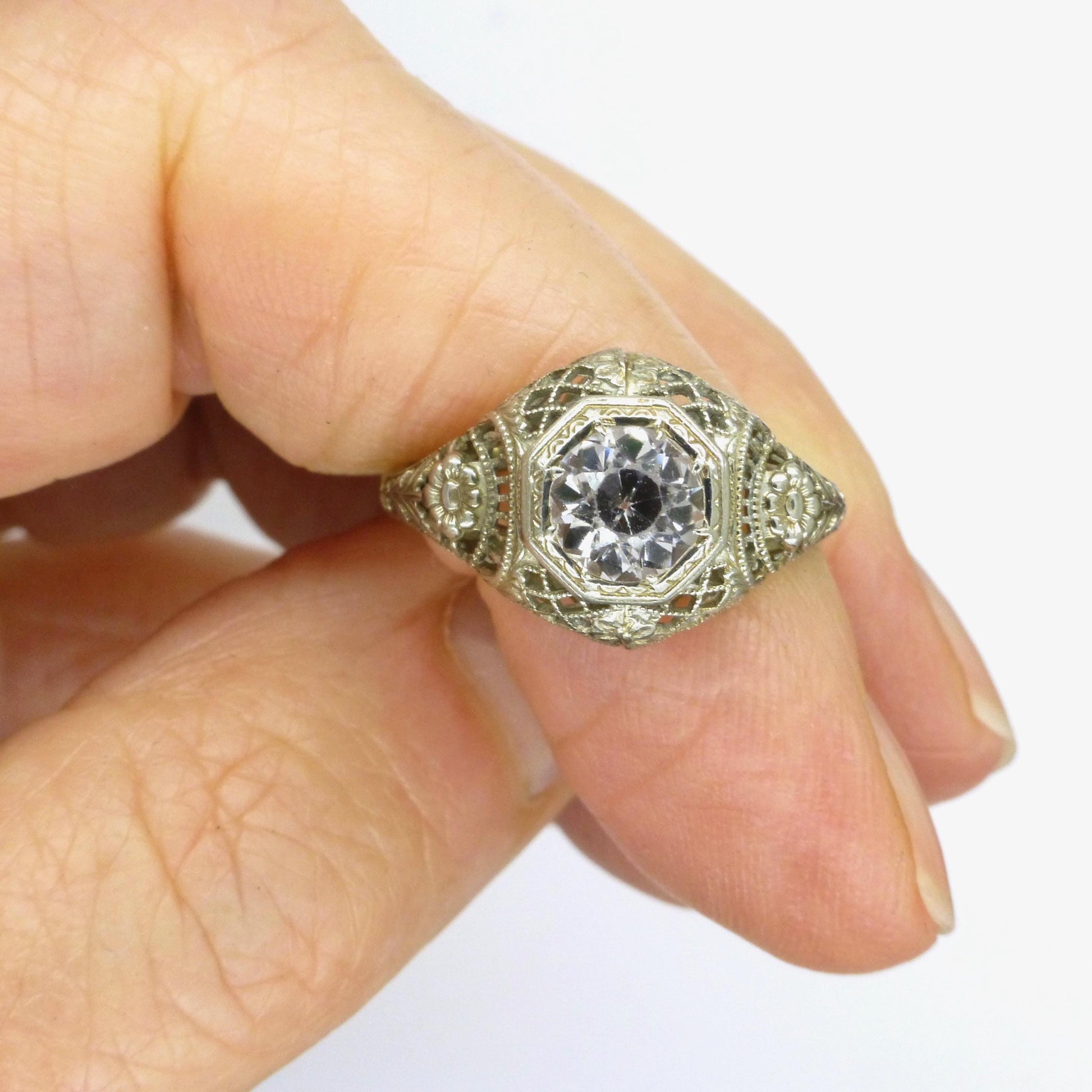 Antique white gold filigree and white sapphire solitaire ring c1900's